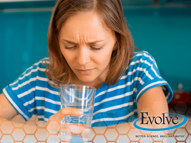 Women looking at glass of water